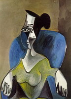 Woman sitting in a blue armchair