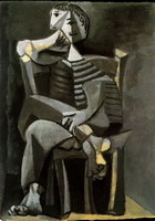 Pablo Picasso. Man sitting knitting striped