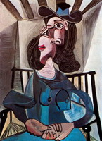 Woman with a hat sitting in a chair (Dora Maar)
