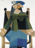 Woman sitting in an armchair