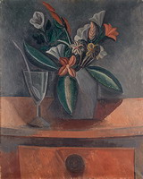 Vase of flowers, glass of wine, and spoon