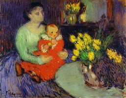 Mother and child in front of a vase of flowers